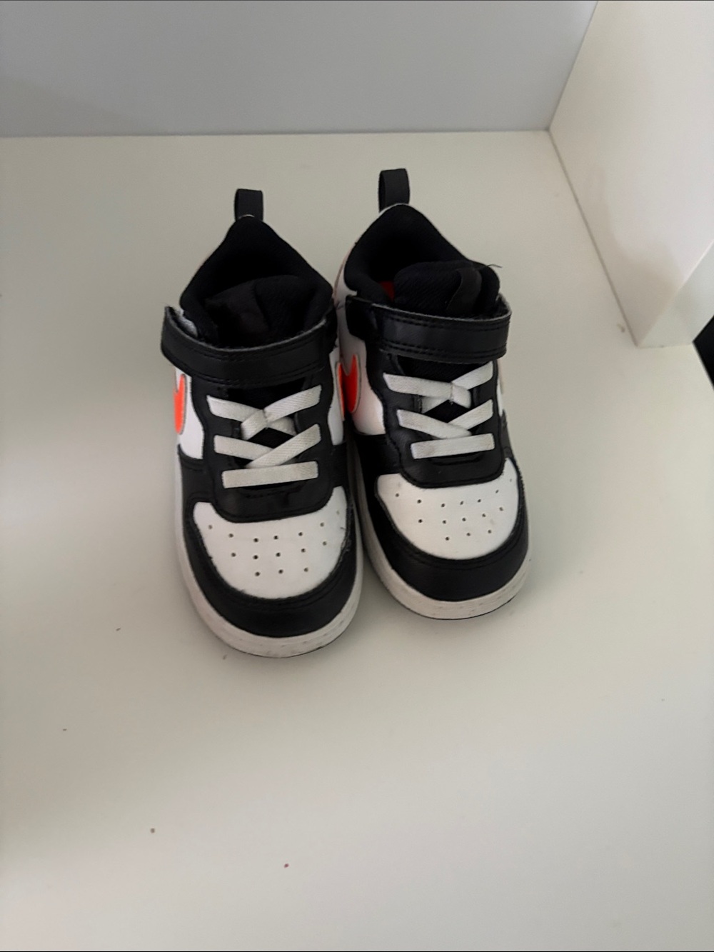 Nike Kids Black White Sneakers with Orange Swoosh